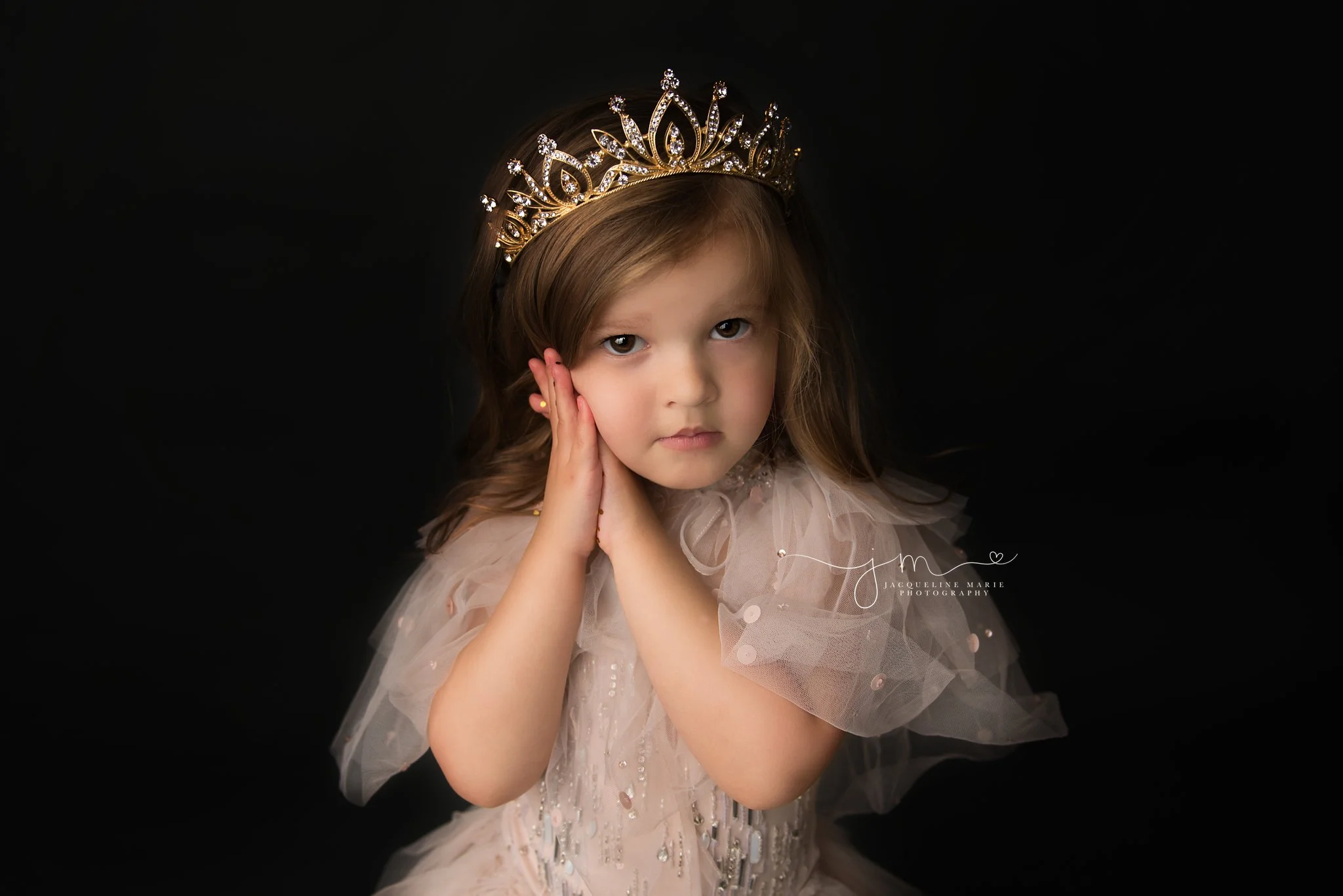 glitter photo session for three year old little girl wearing gold crown and pink tutu du monde dress in columbus ohio