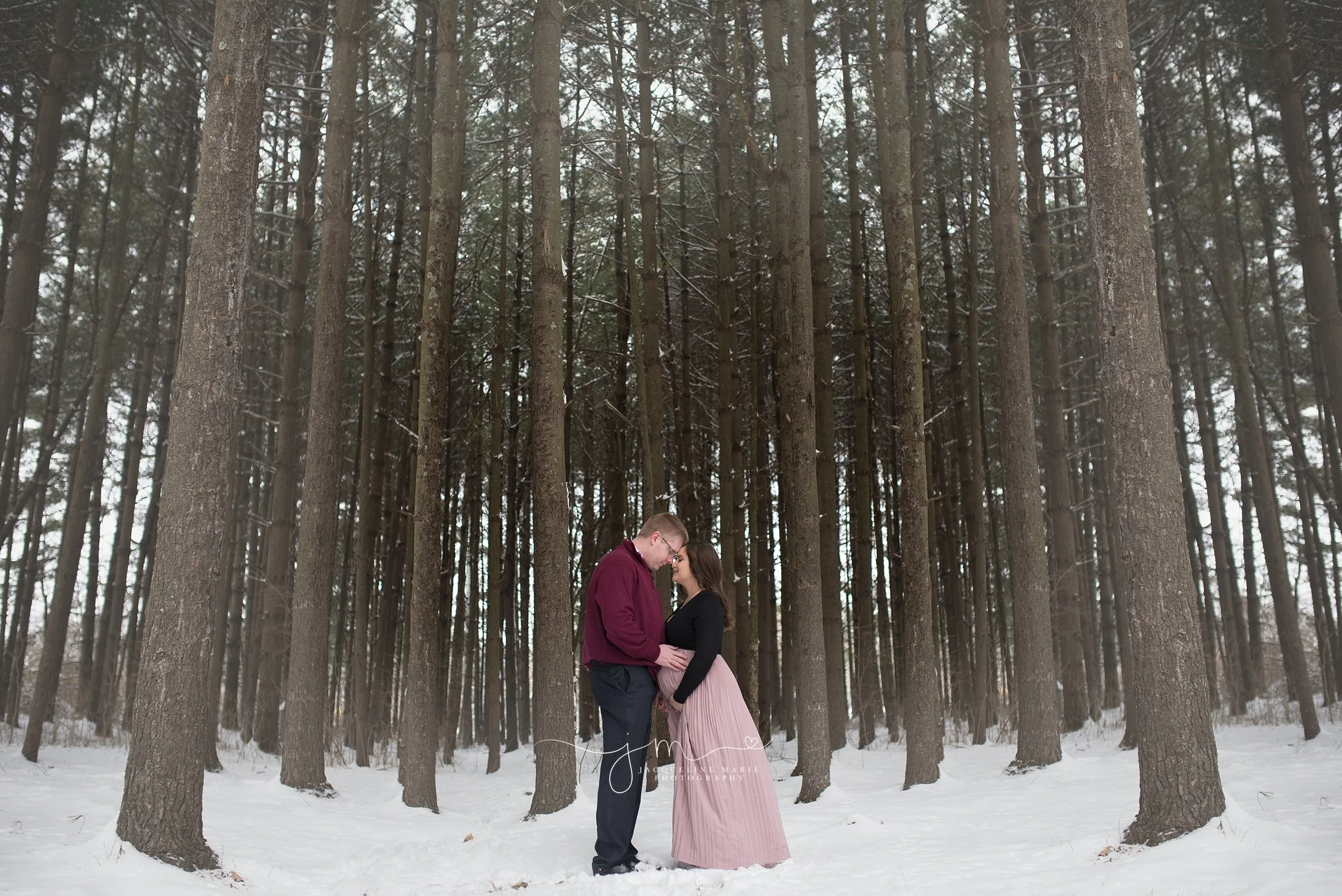 maternity session with mother and father in the snow in columbus ohio