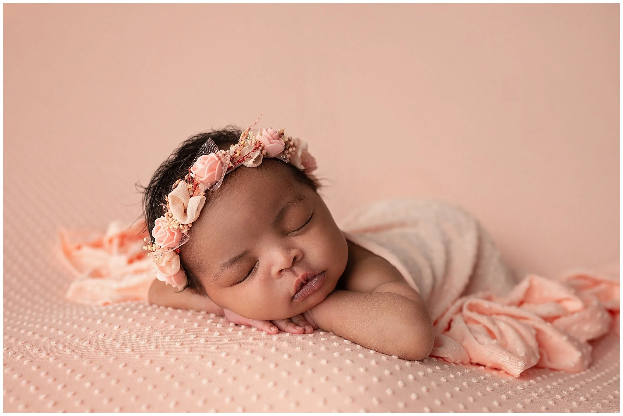 newborn baby girl wearing pink floral crown for newborn photography session in Columbus ohio