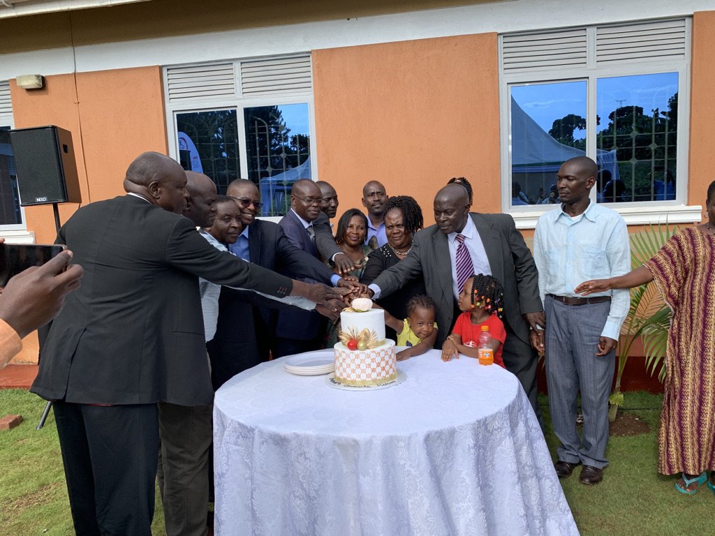cutting a cake at the medical facility opening