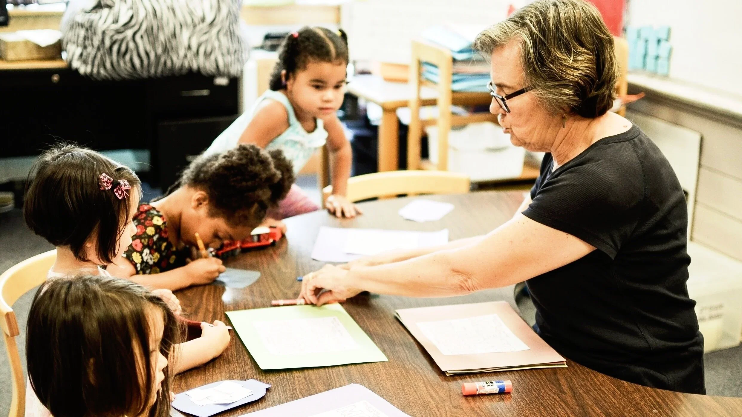children with teacher at Children's Ministry