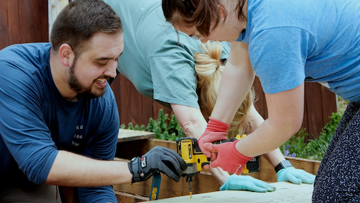Church members fixing something together