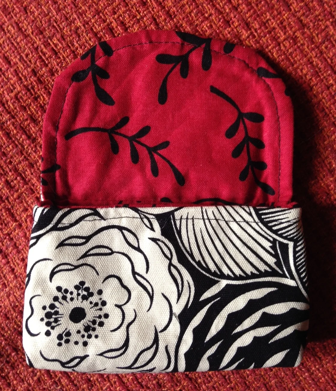 black and white with red inside credit card sized wallet