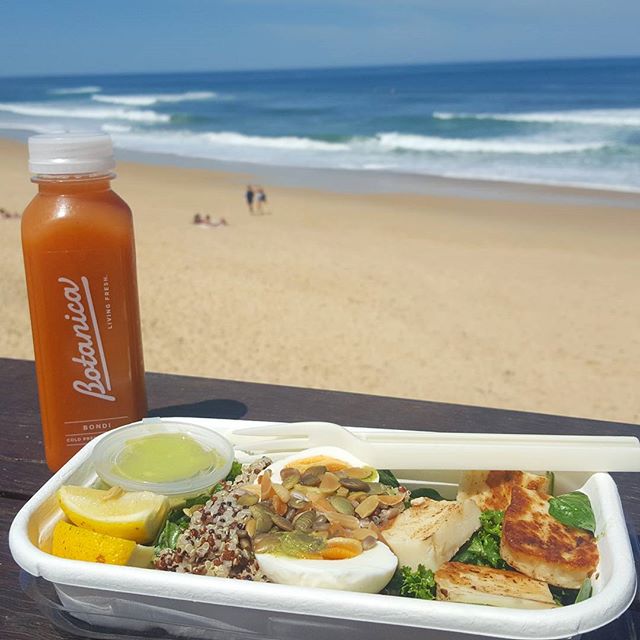 Late lunch enjoying the sunshine! This is a halloumi, egg, quinoa, avo, kale salad with a refreshing Bondi juice rich in vitamin C and betacarotene (great for protecting the skin!) #mindfulnutrition #fuelyourbody  #healthyeating #salad #lovewhereyoul