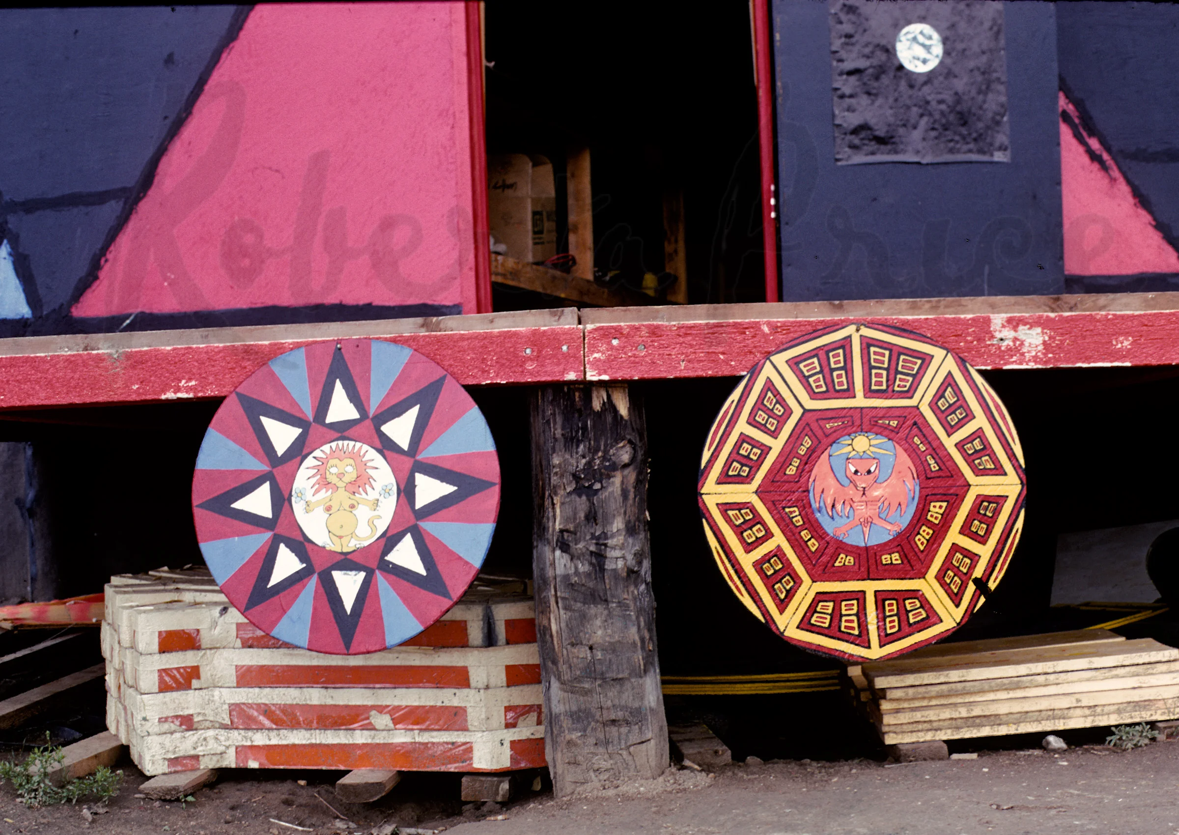 30-Shields painted by Dean -- Linda's at left, Dean's at right-- nailed on porch of their dome, Libre, Summer, 1969.jpg