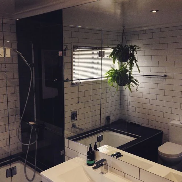 Some new ferns in the bathroom are loving Brissies winter light #brisbanedesign #bathroomdesign #hangingbasket #lovebne #interiordesign