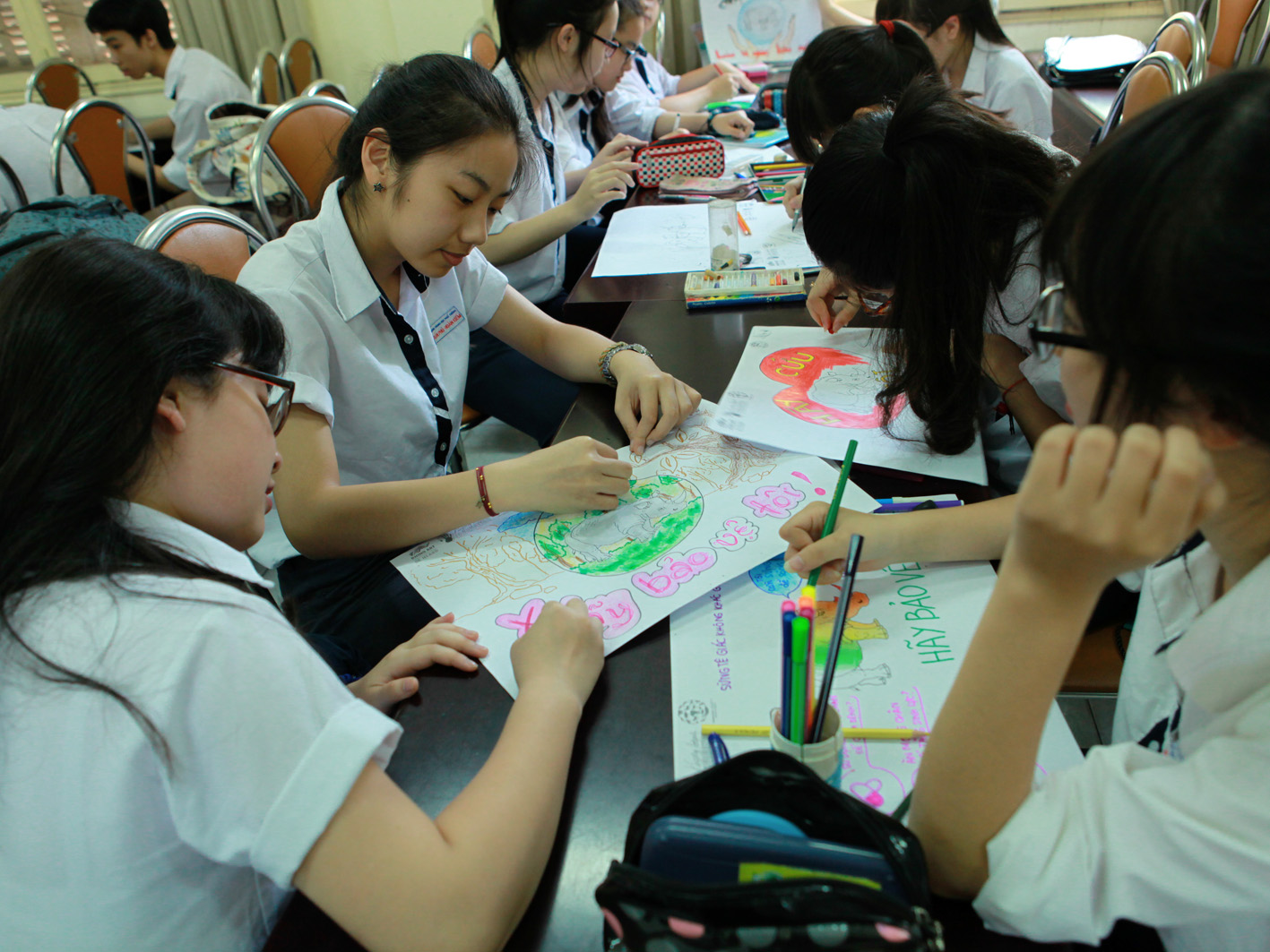 Students at Tran Phu high school working on their entries