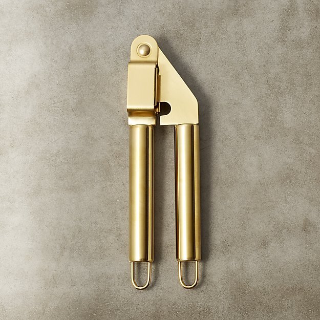 I'm a diehard garlic chopper that has never understood the need for a garlic press...but I'm pretty sure this gold one could convert even a cutting board lifer like me. 