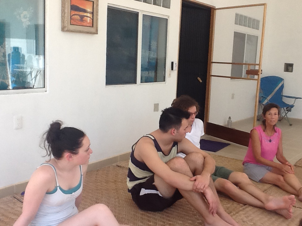 Jesse Herndon (center) reflects with the group on his relationship to their new discoveries about trusting what authentically happens in his singing and acting performance processes.