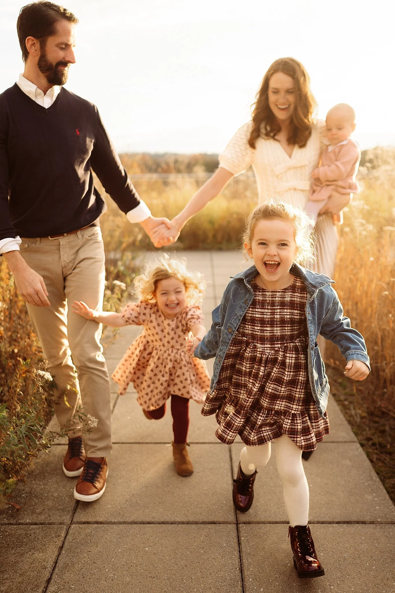 family photo session at Phipps Botanical Conservatory with young girls running
