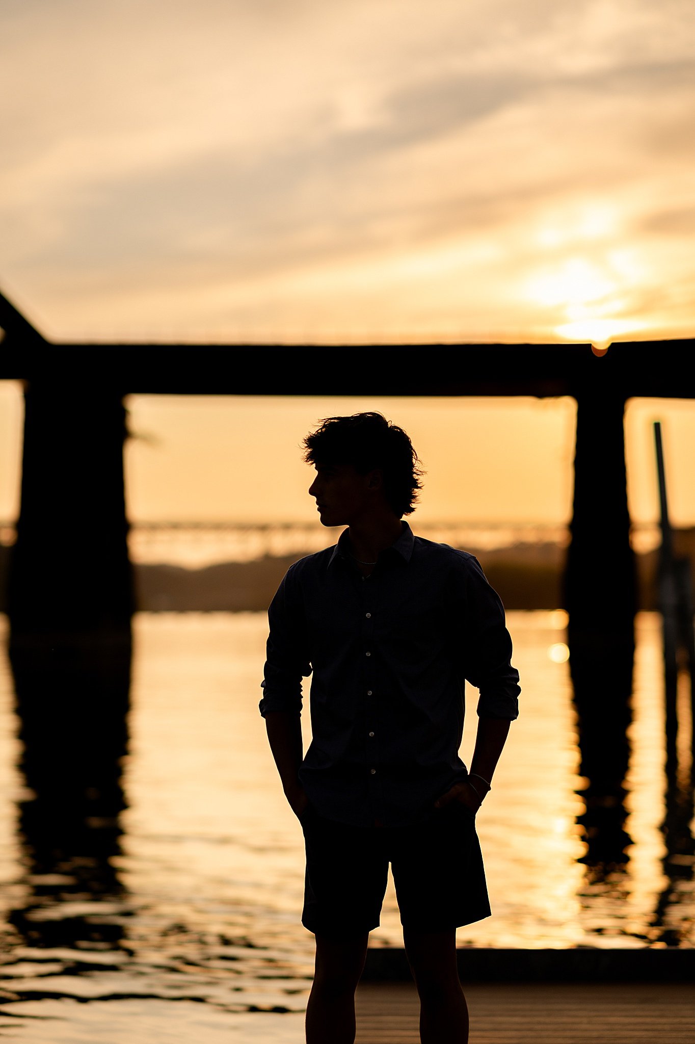 golden hour silhouette senior session boy athlete
