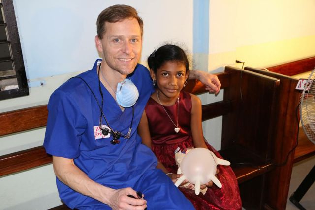 Dr. Greg with patient.jpg