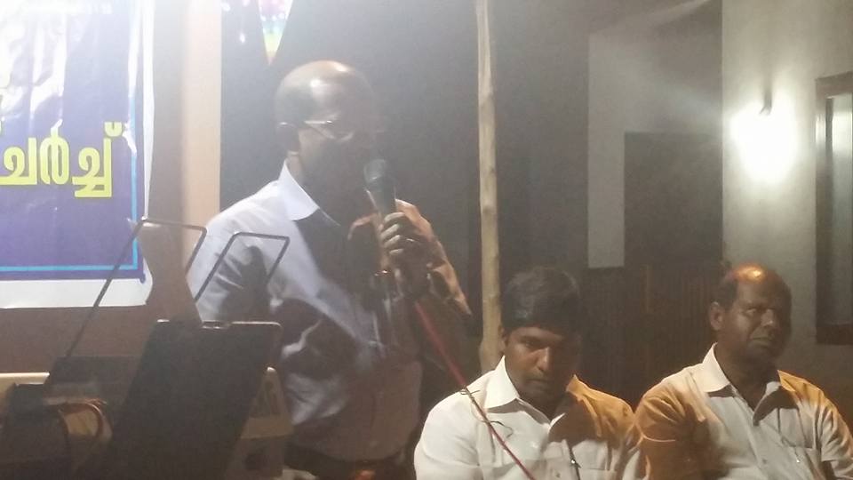 Pastor Thomas with Word of God.