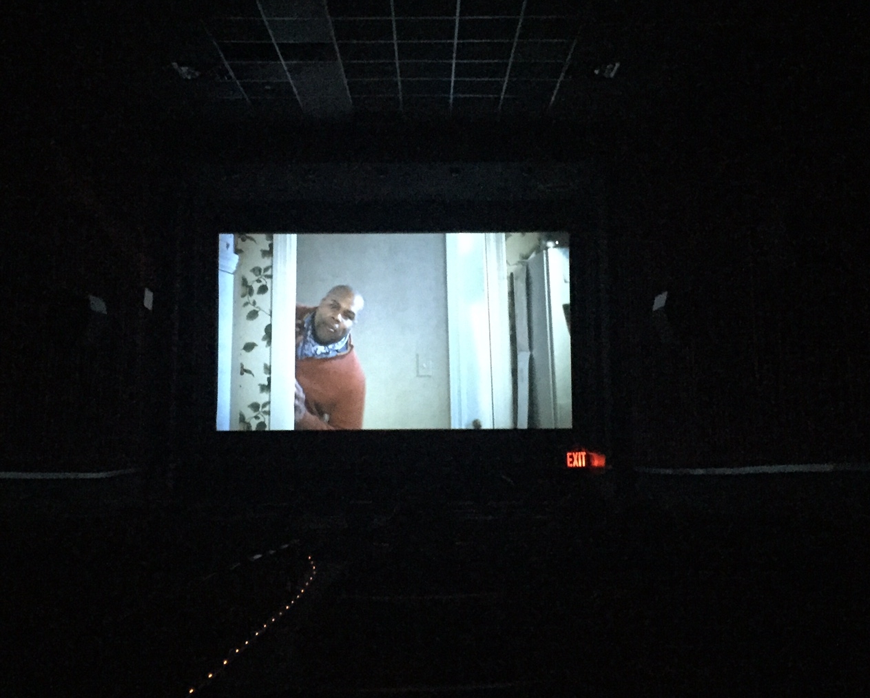 Kevin on the big screen! (see the floor lights and exit sign? we're LEGIT in a theater!)
