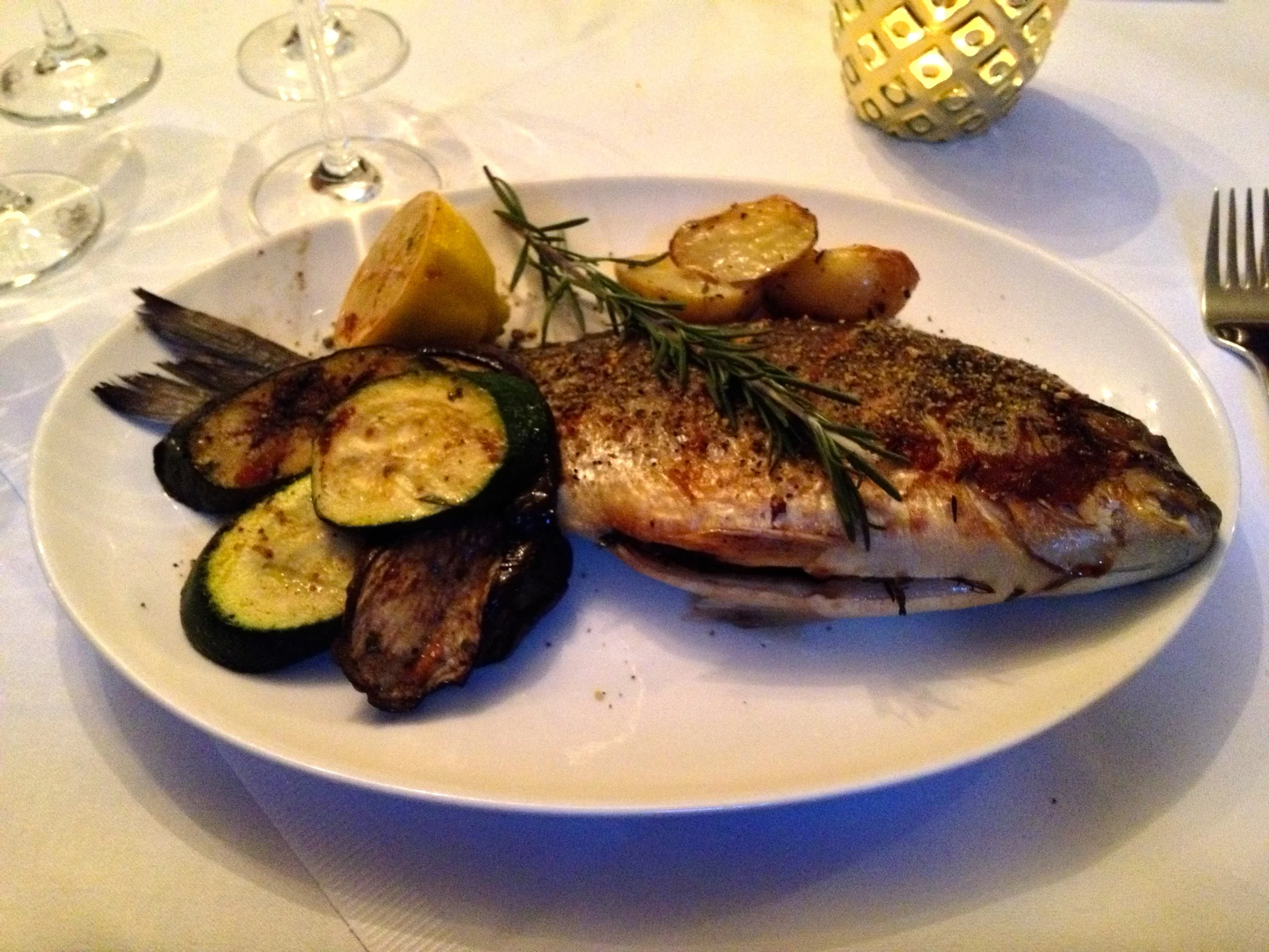 Grilled dorade with rosemary potatoes and grilled vegetables