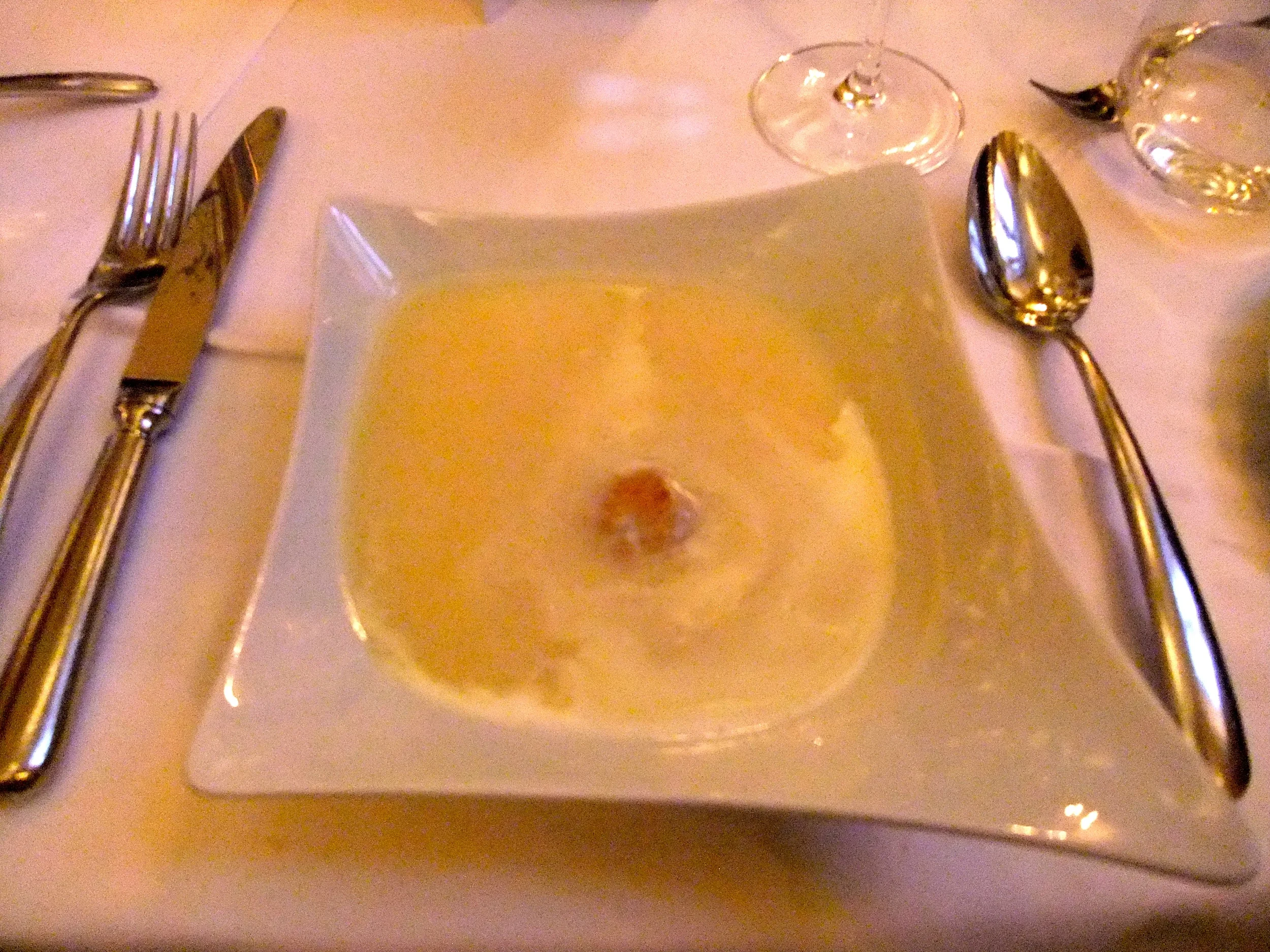 White lemon soup with curd cheese-rosemary dumpling and cream topping