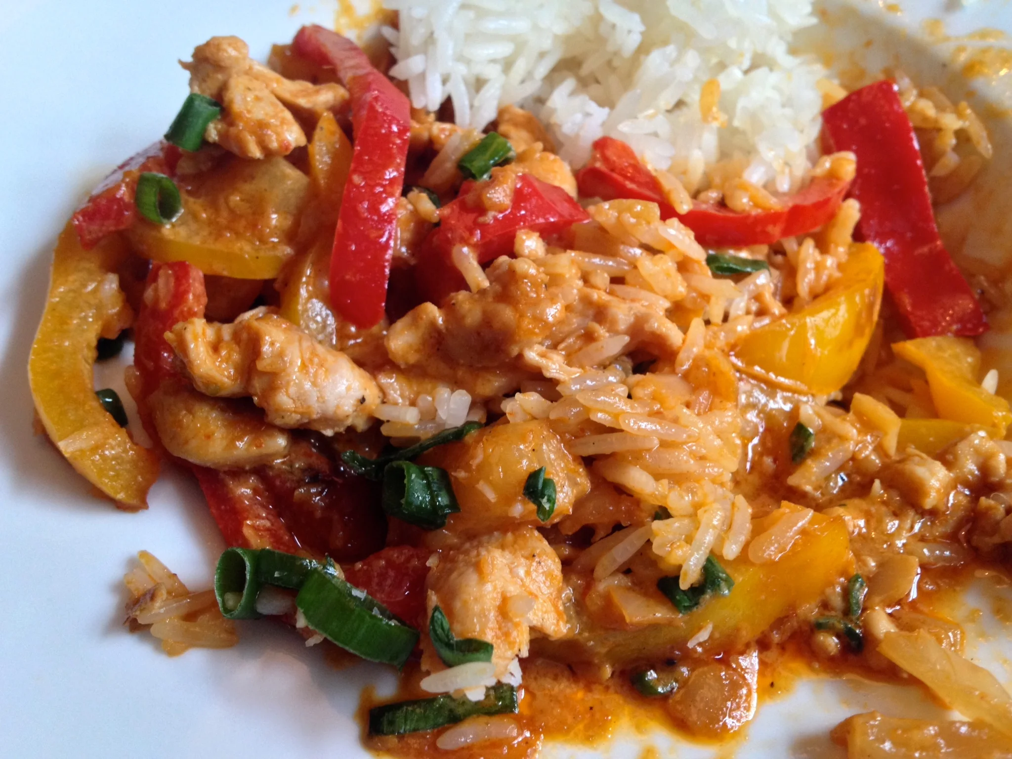 Chicken in red curry sauce with pineapple and peppers