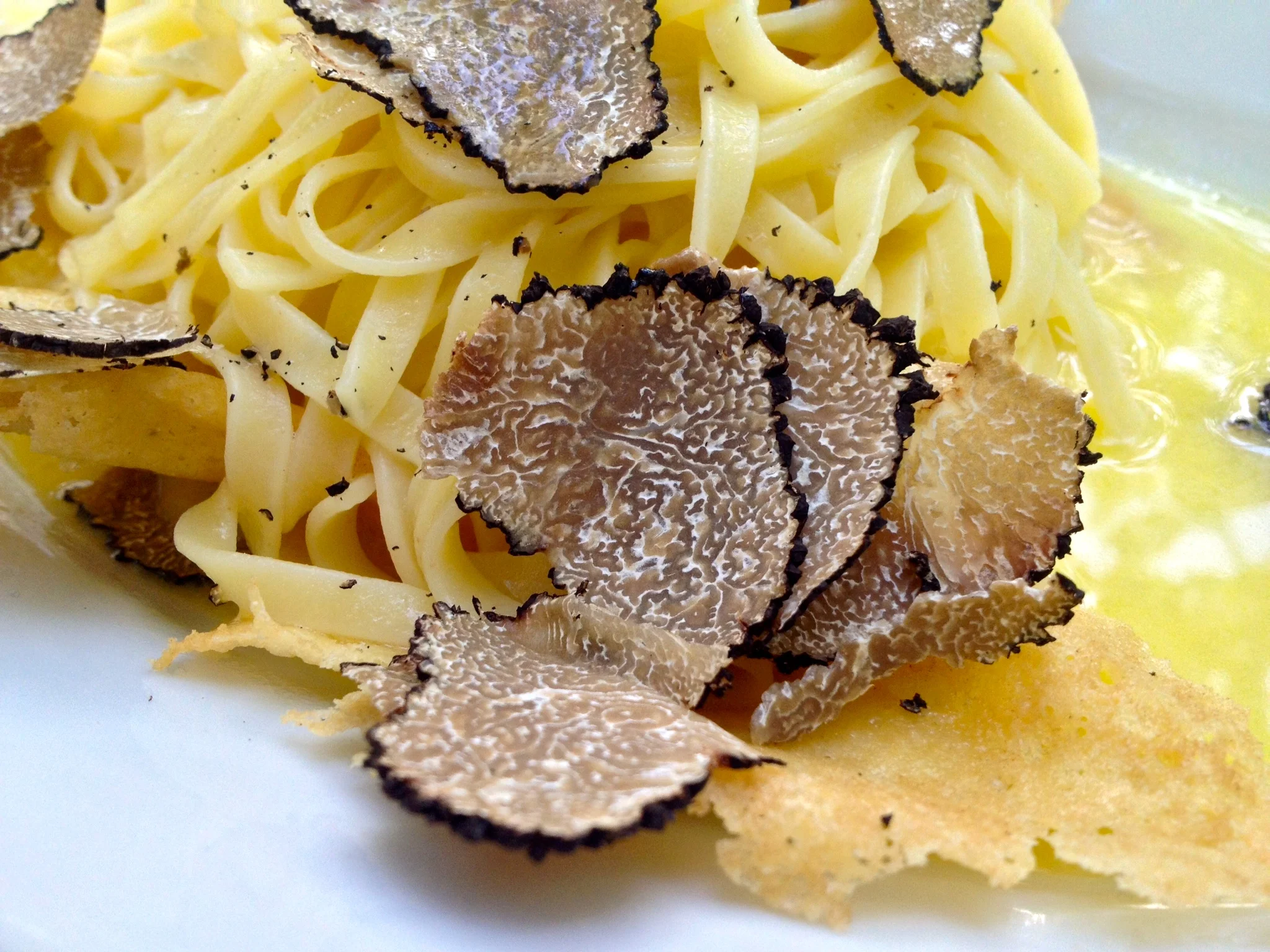 Tagliolini with shaved black truffles and parmesan crisps at La Piazza