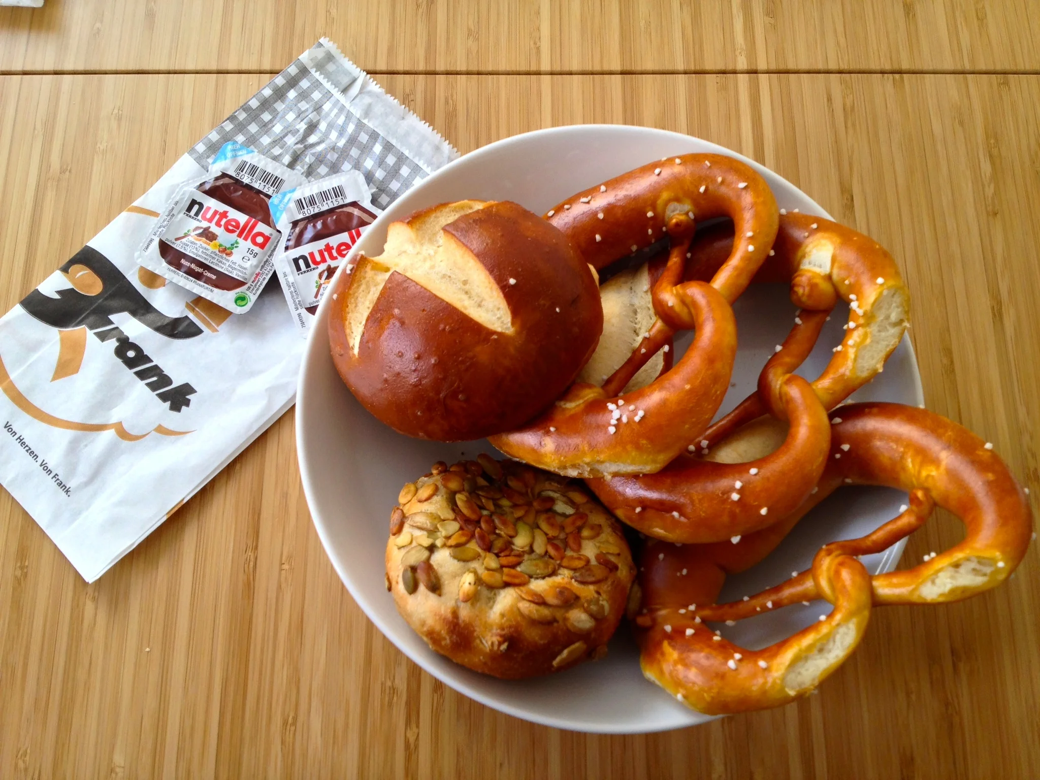 A Laugenbrötchen at the top left, three pretzels, and a Kürbiskern Brötchen to the bottom left (click for a larger image)
