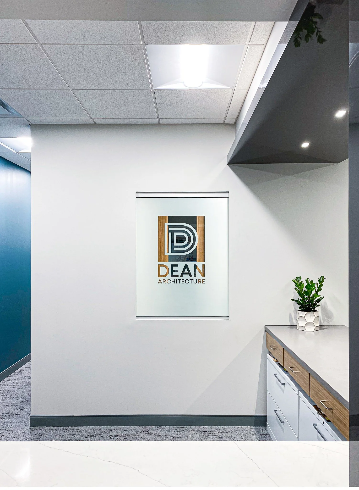 This window is in the lobby, behind reception. It peeks into the marketing office but really you can see straight into mine when my light is on.
