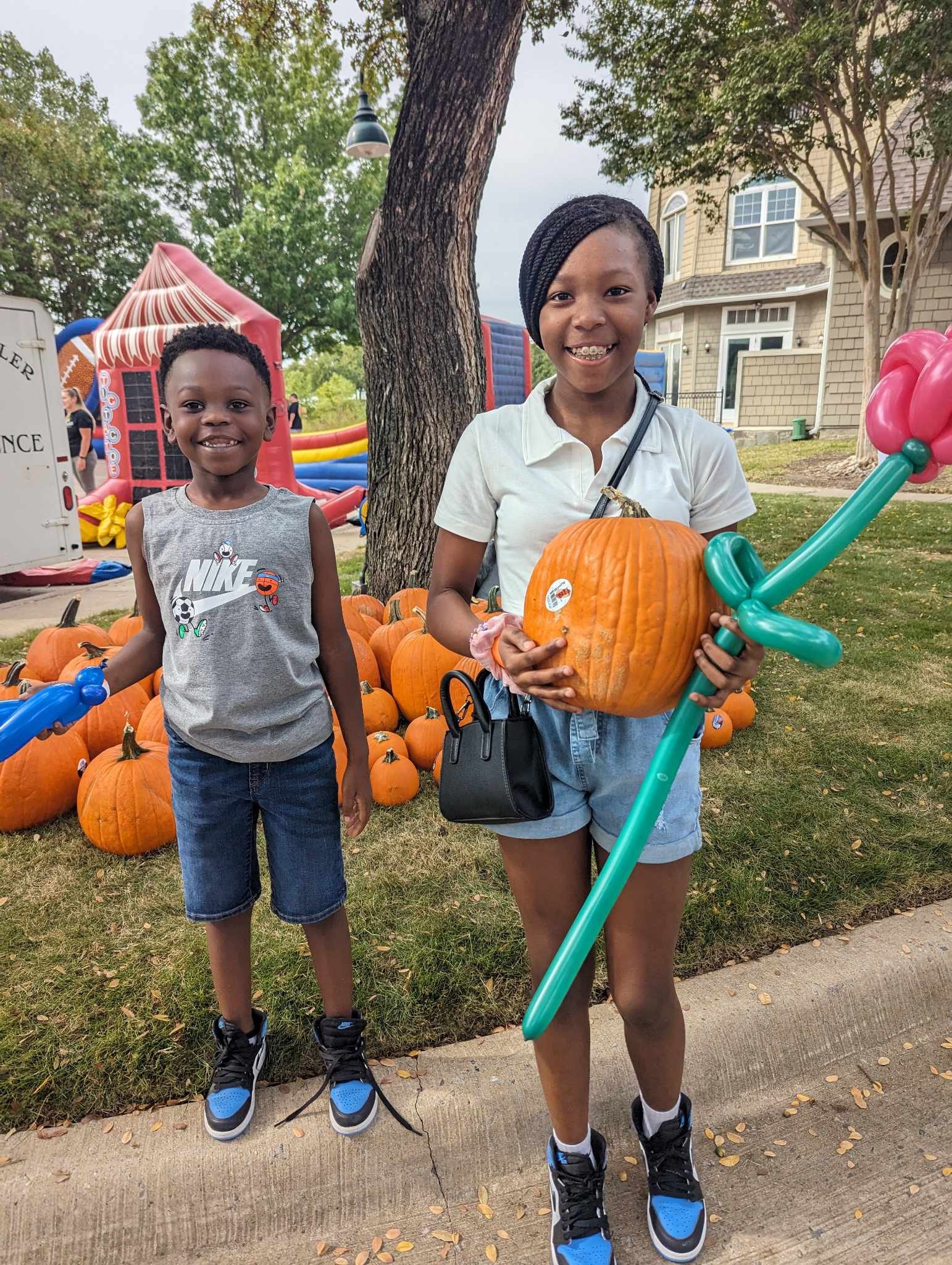 Kids getting pumpkins.jpg