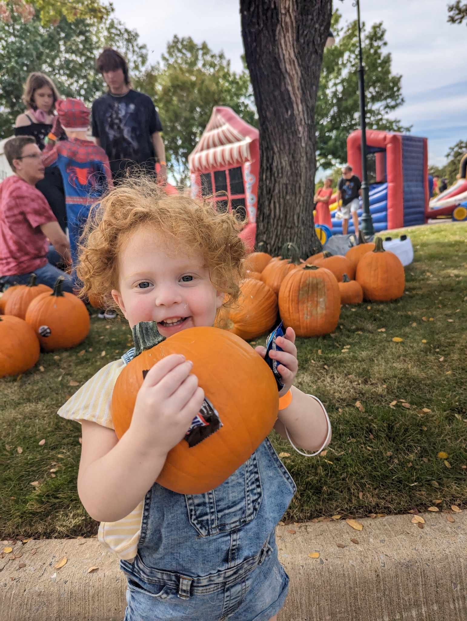 Little girl and her pumpkin.jpg