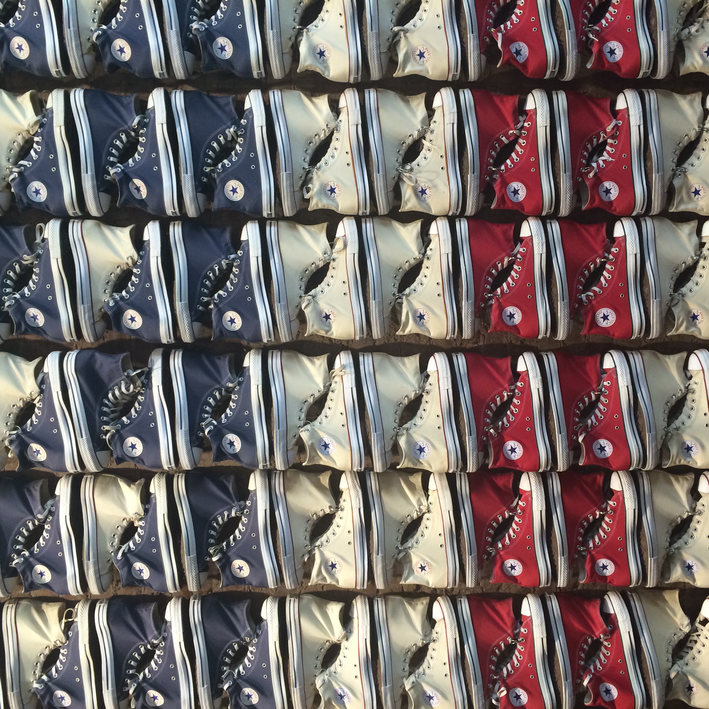 A wall of sneakers at Converse, my go-to walking shoes on this trip.