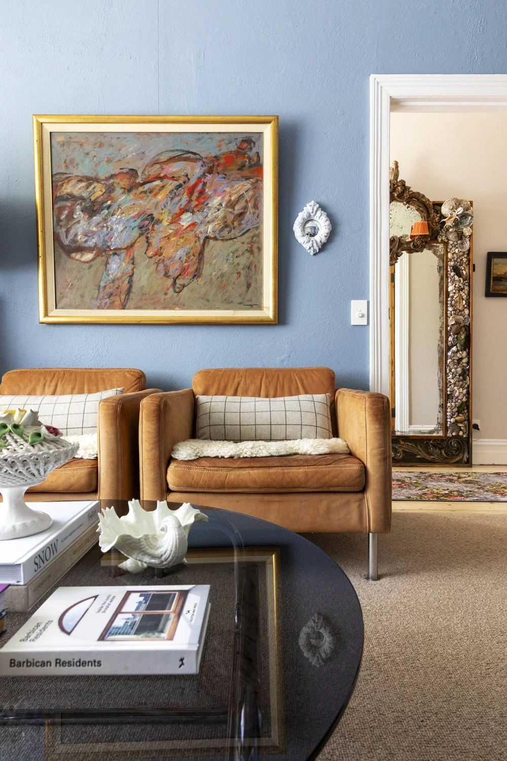 Tan leather armchairs in blue painted sitting room designed by Meredith Lee interior designers Melbourne