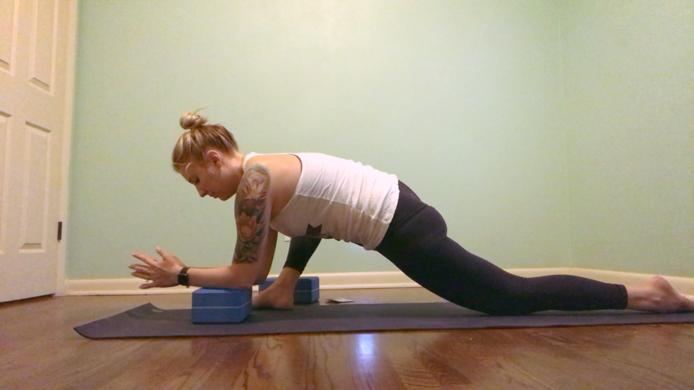 Lizard pose with forearms on block