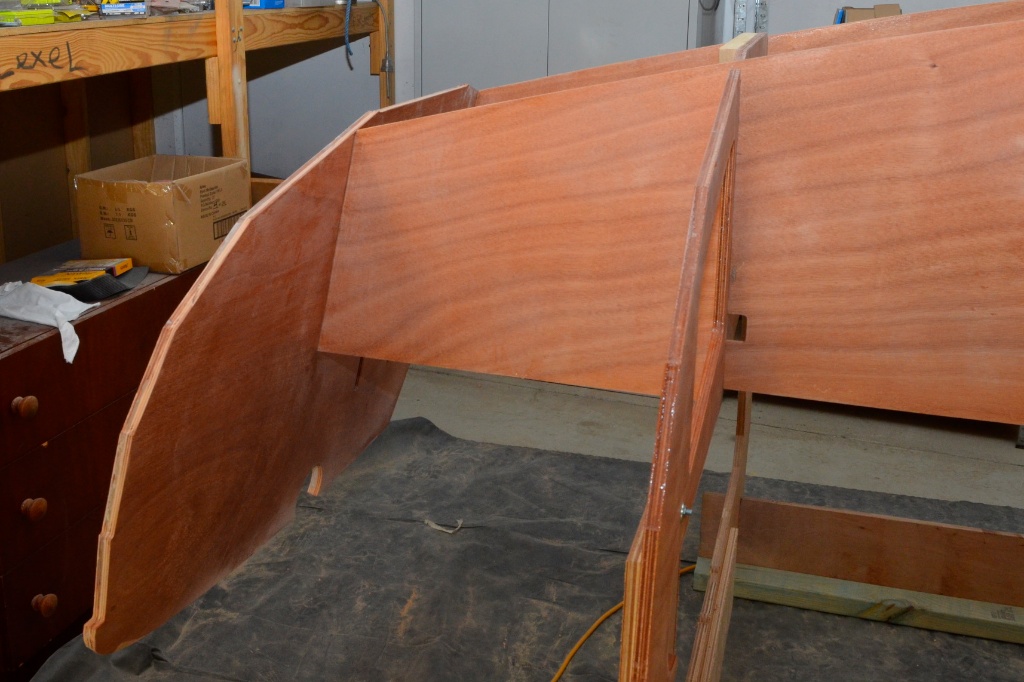 Transom is fitted by locating fore and aft frames into the mortices in the inner layer, these will be filleted later.