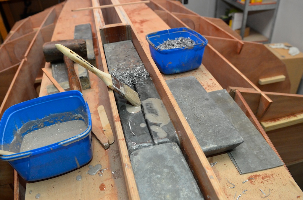 As more lead is fitted I use epoxy with glue powder mixed with lead shavings to fill the gaps