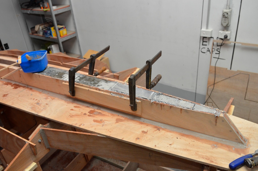As the keel fills I used clamps to prevent the keel from splaying as I pack the shavings and epoxy in 