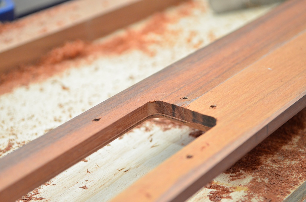 Then the plank is turned over and flush cut again with the bearing resting on the edge of the radius, leaving a slot approximately 1mm larger all round and a radius so I can lay sheathing cloth into the edge.