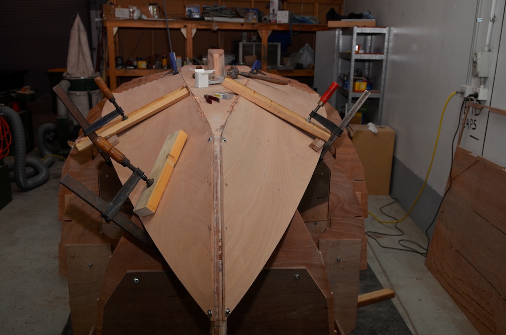 Planks fixed down in place without the aft ends attached. I also used some screws in the frames to hold the planks in position. 