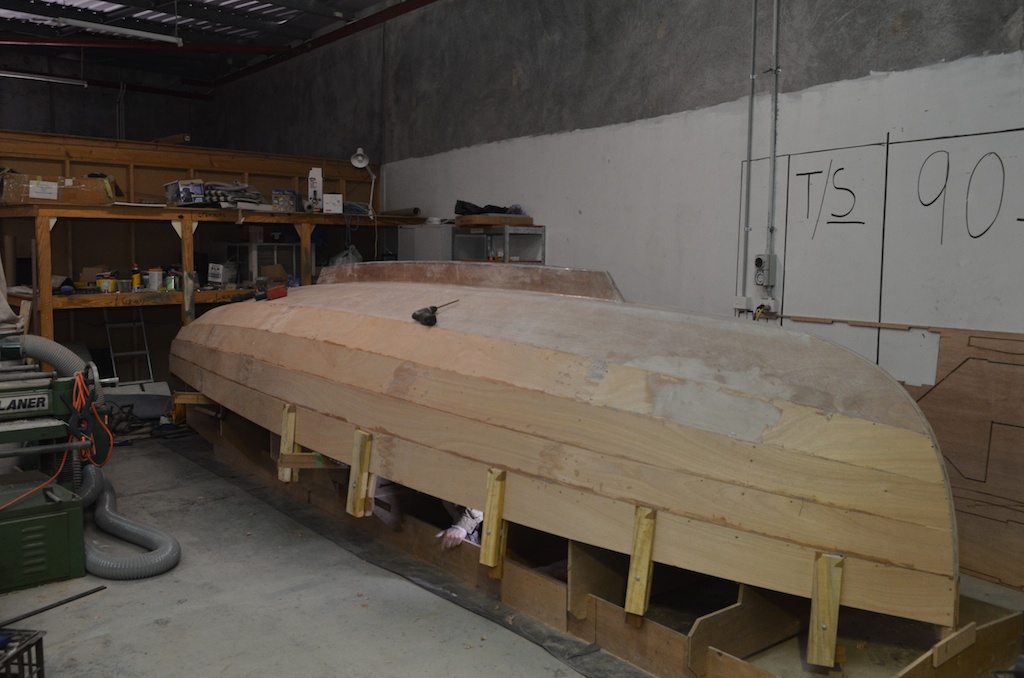 Side view showing wooden plank clamps and supports for the plank.