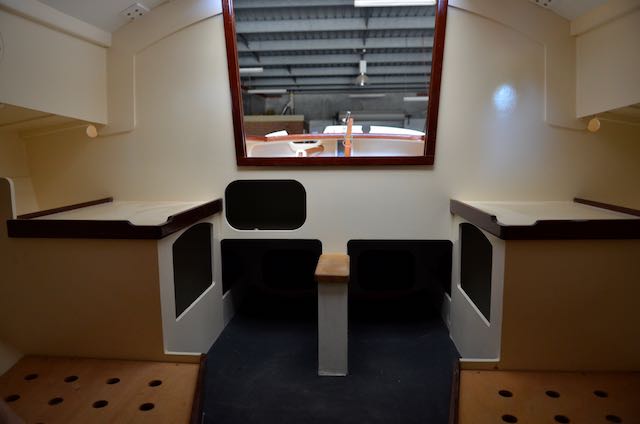 Companionway looking aft, the spaces either side of the centreboard case are for a port-potti and esky.