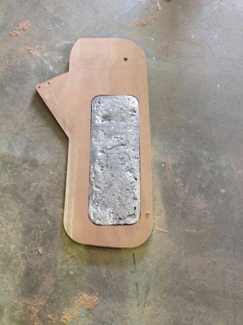 The centreboard is cut from three pieces of 18 mm ply, this is the centre piece with 30 kg of lead inserted.