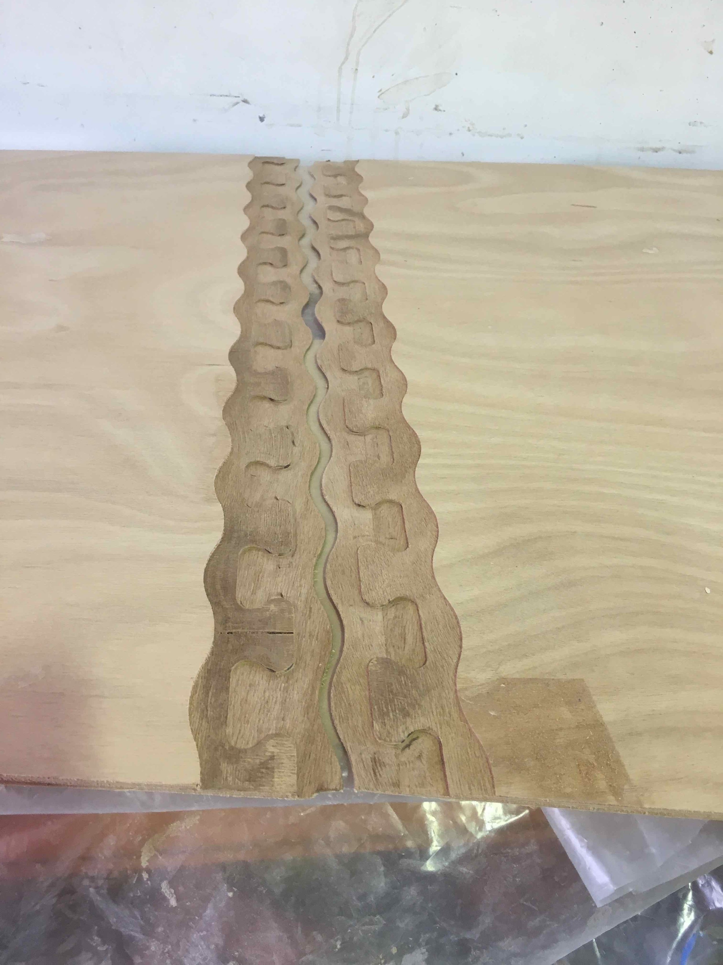 Both ends of the bottom panel waiting to be glued together.