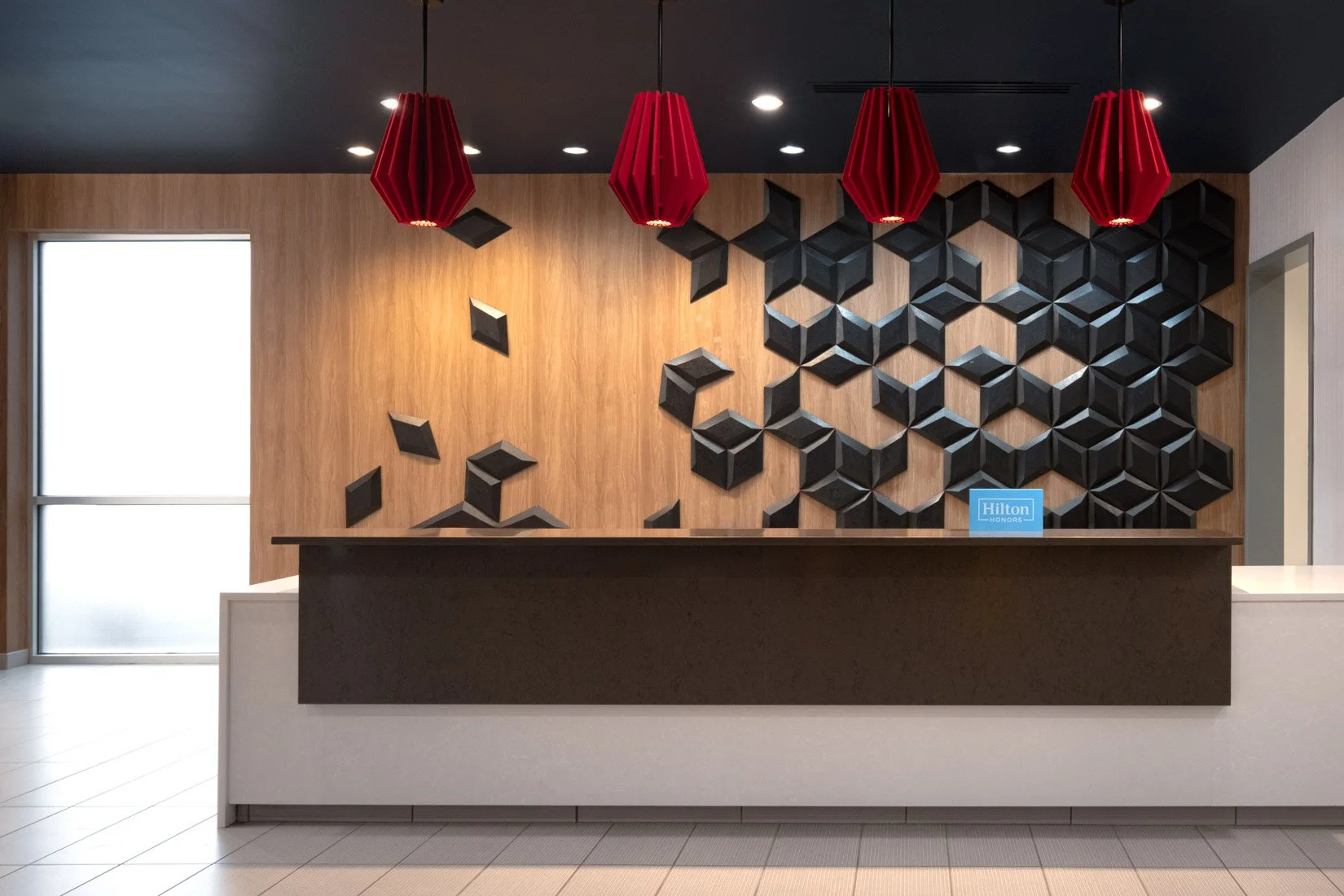  Original Filename: BNALIHT_Home2_frontdesk_4905.jpg File Name: front_desk Caption: Front desk area Marketing Caption: The front desk at Home2 Suites by Hilton Spring Hill TN offers friendly guest service. Alternate Tag: Hotel front desk with counter