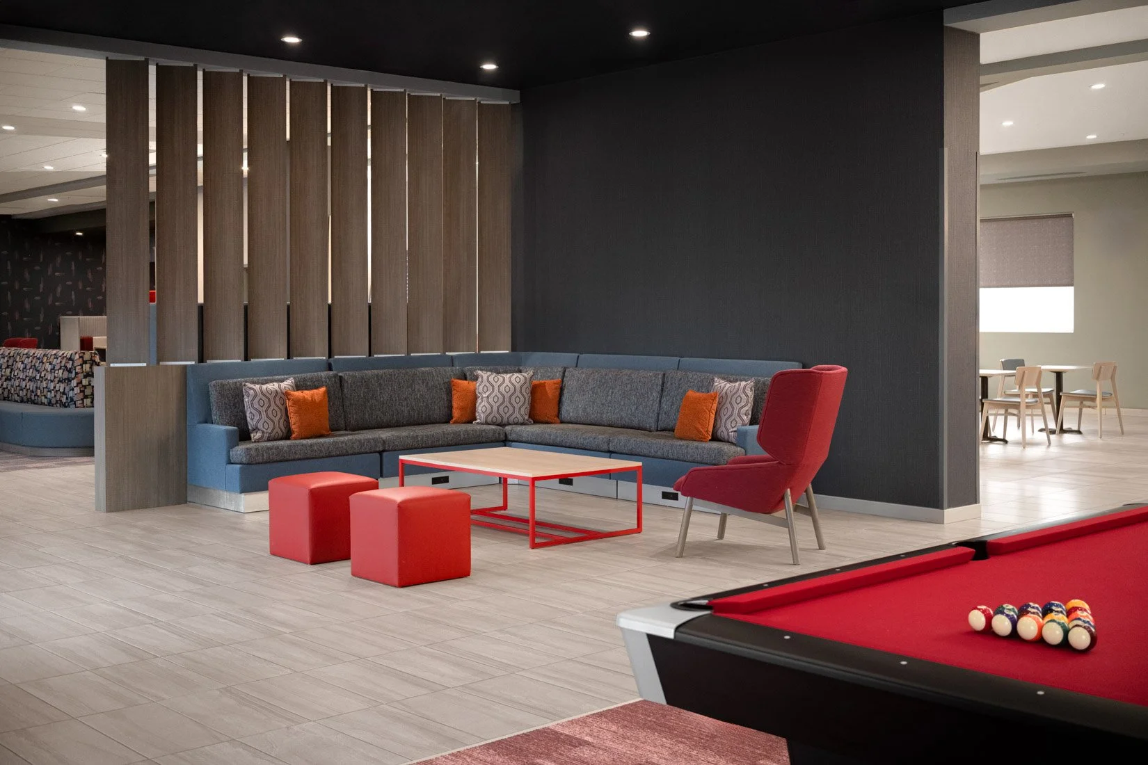  Original Filename: BNALIHT_Home2_lobbygameseating_4914.jpg File Name: game_seating Caption: Lobby game seating Marketing Caption: Casual seating near the games area provides a comfortable place to gather. Alternate Tag: Seating area next to games an