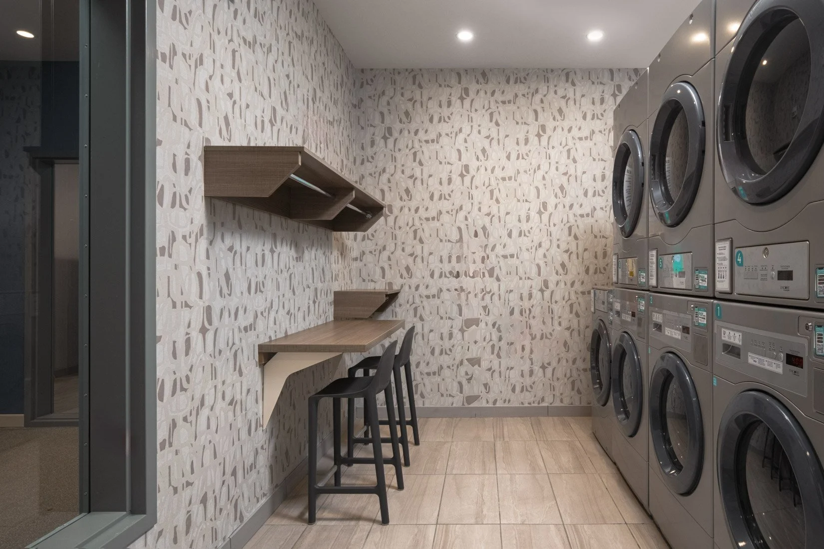  Original Filename: BNALIHT_Home2_laundry_4921.jpg File Name: guest_laundry Caption: Guest laundry room Marketing Caption: Convenient guest laundry facilities available for extended stay travelers. Alternate Tag: Laundry room with washers and dryers 