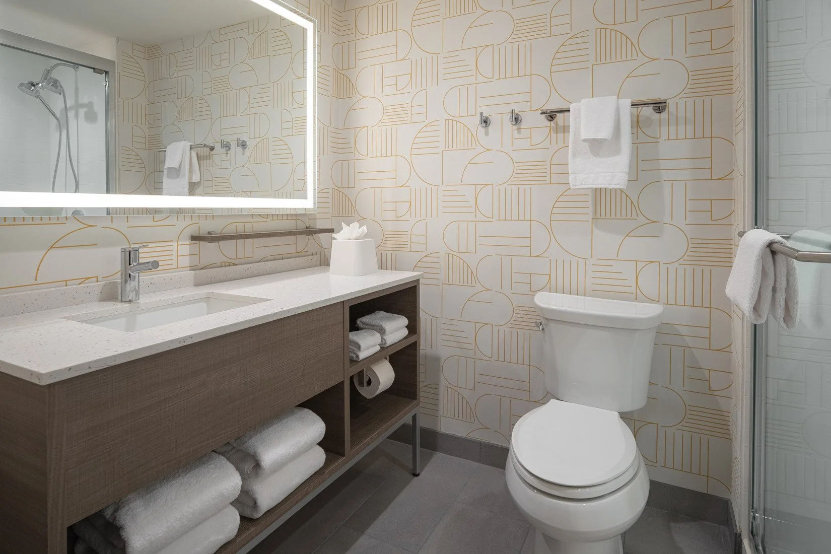  Original Filename: BNALIHT_Home2_roombath_4942.jpg File Name: guest_bathroom Caption: Guest room bathroom Marketing Caption: Modern guest bathroom with vanity and shower. Alternate Tag: Bathroom with vanity mirror and sink Keywords: guest bathroom, 