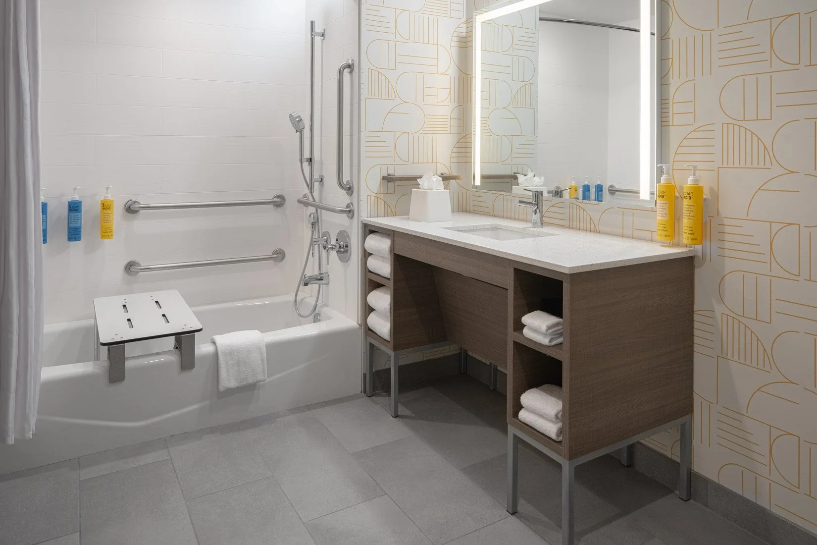  Original Filename: BNALIHT_Home2_roombath_ADA_4944.jpg File Name: ada_bathroom Caption: Accessible bathroom Marketing Caption: Accessible guest bathroom designed for comfort and convenience. Alternate Tag: Accessible bathroom with grab bars and roll