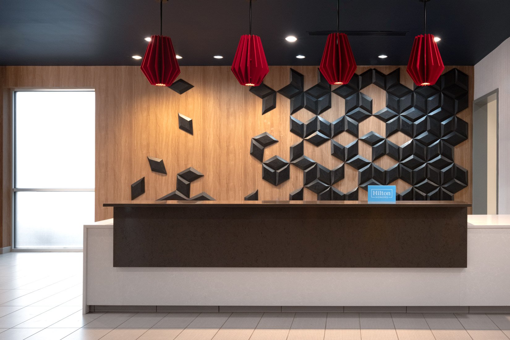  Original Filename: 3905_BNASPRU_TRU_frontdesk.jpg File Name: Tru-Front-Desk.jpg Caption: Front desk at Tru by Hilton Spring Hill Marketing Caption: Modern front desk at Tru by Hilton Spring Hill offering convenient guest services. Alternate Tag: Tru