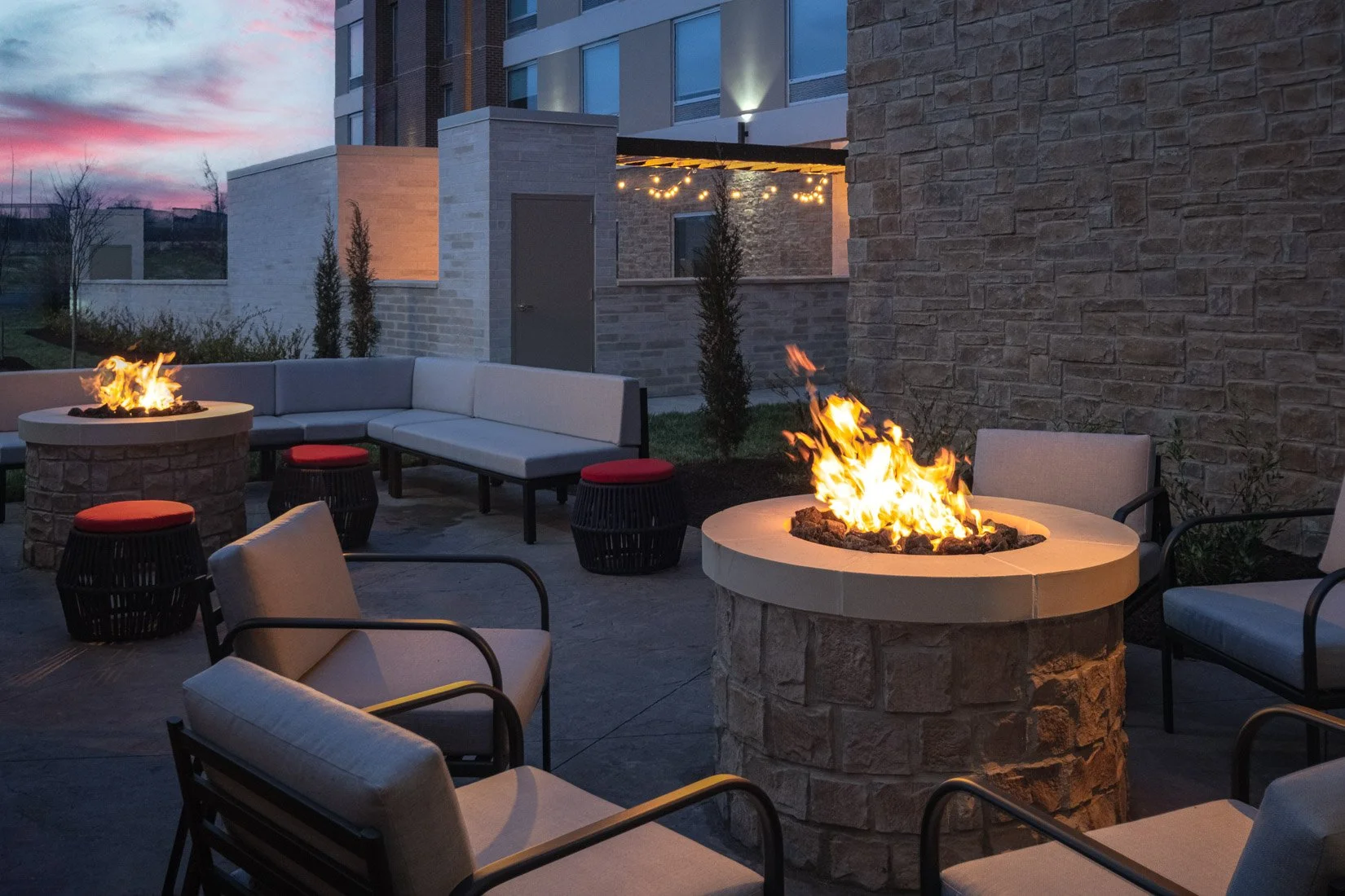  Original Filename: 3924_BNASPRU_TRU_firepit.jpg File Name: Tru-Firepit.jpg Caption: Outdoor fire pit seating area Marketing Caption: Cozy outdoor fire pit area at Tru by Hilton Spring Hill ideal for relaxing evenings. Alternate Tag: Tru hotel fire p