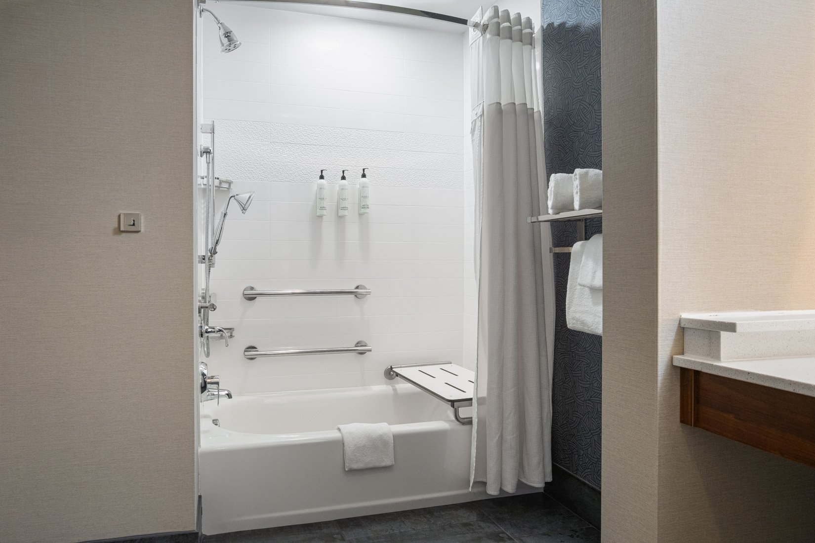  Original Filename: 1717_GTLFG_Fairfield_adashowertub.jpg File Name: GTLFG-Accessible-Bathroom-Tub.jpg Caption: Accessible bathroom with tub and grab bars Marketing Caption: Accessible guest bathroom with bathtub and safety grab bars at Fairfield Inn