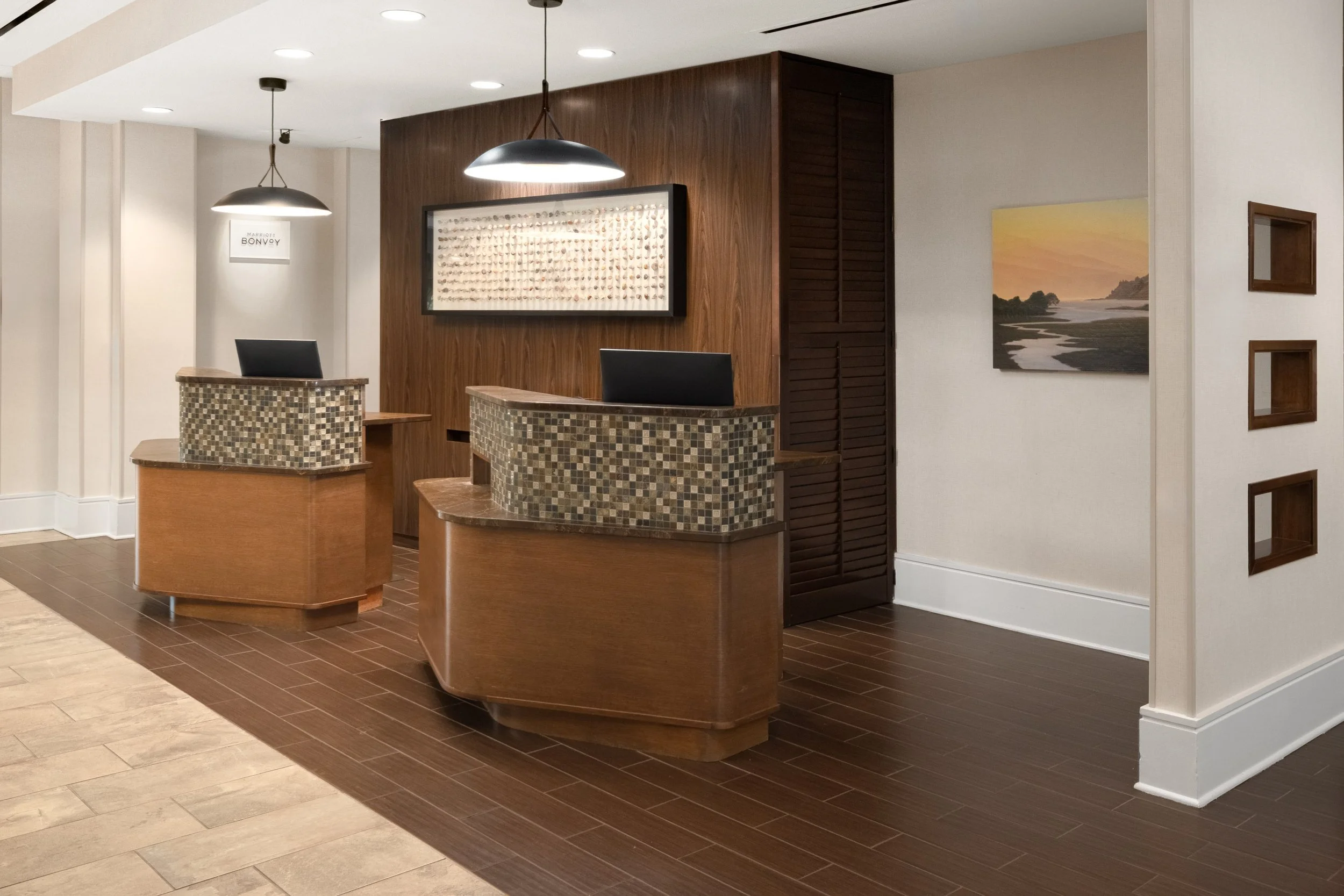  ORIGINAL FILENAME:  4905_TYSCP_Courtyard_frontdesk.jpg  FILE NAME:  Front Desk  PHOTO PLACEMENT TAG:  Search in DAC for: Lobby  CAPTION:  Front Desk  MARKETING CAPTION:  The front desk area features two service stations with warm wood finishes and n