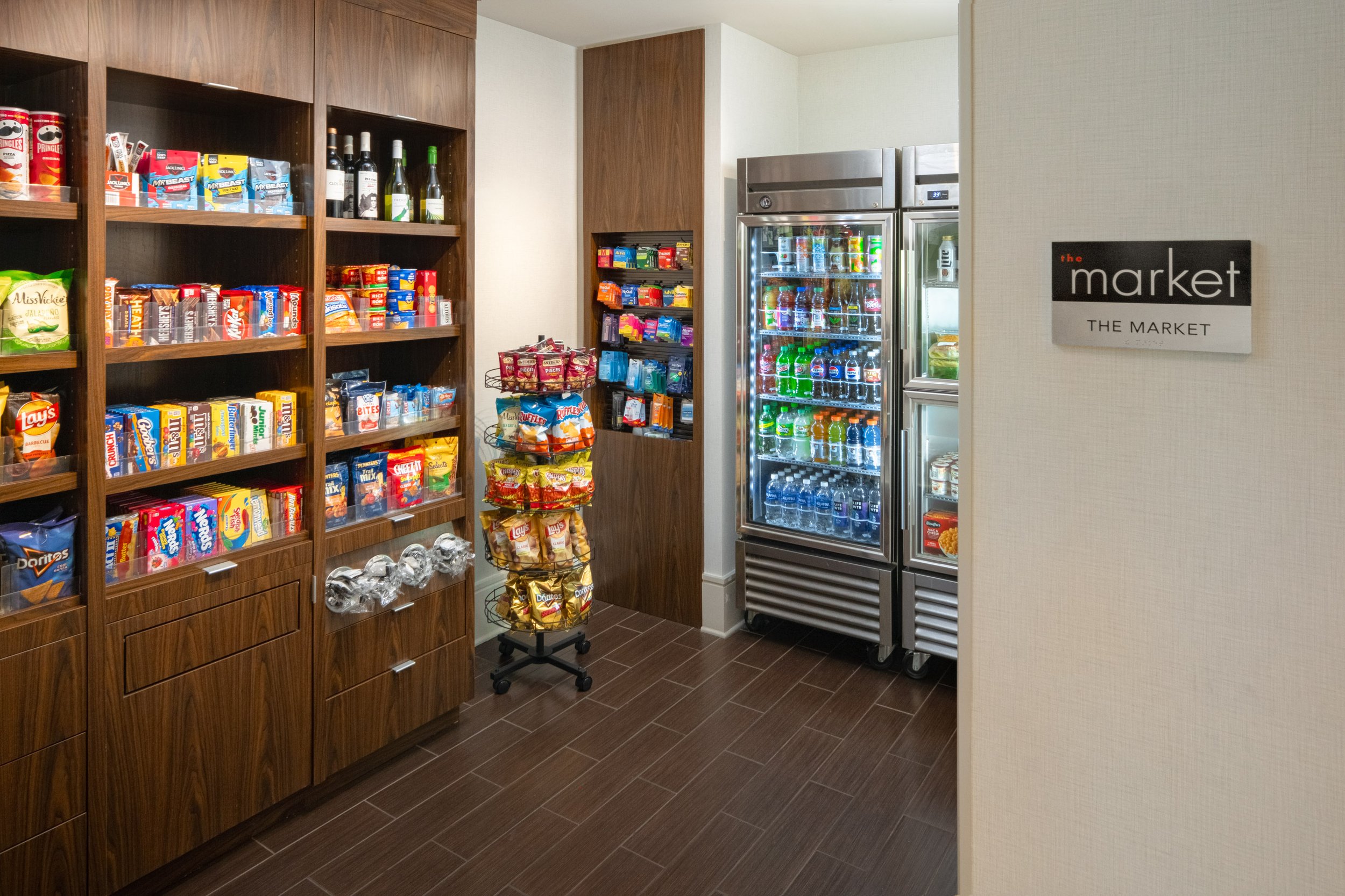  ORIGINAL FILENAME:  4906_TYSCP_Courtyard_market.jpg  FILE NAME:  Market  PHOTO PLACEMENT TAG:  Search in DAC for: Market  CAPTION:  The Market  MARKETING CAPTION:  The Market features packaged snacks, beverages, and grab-and-go options arranged in a