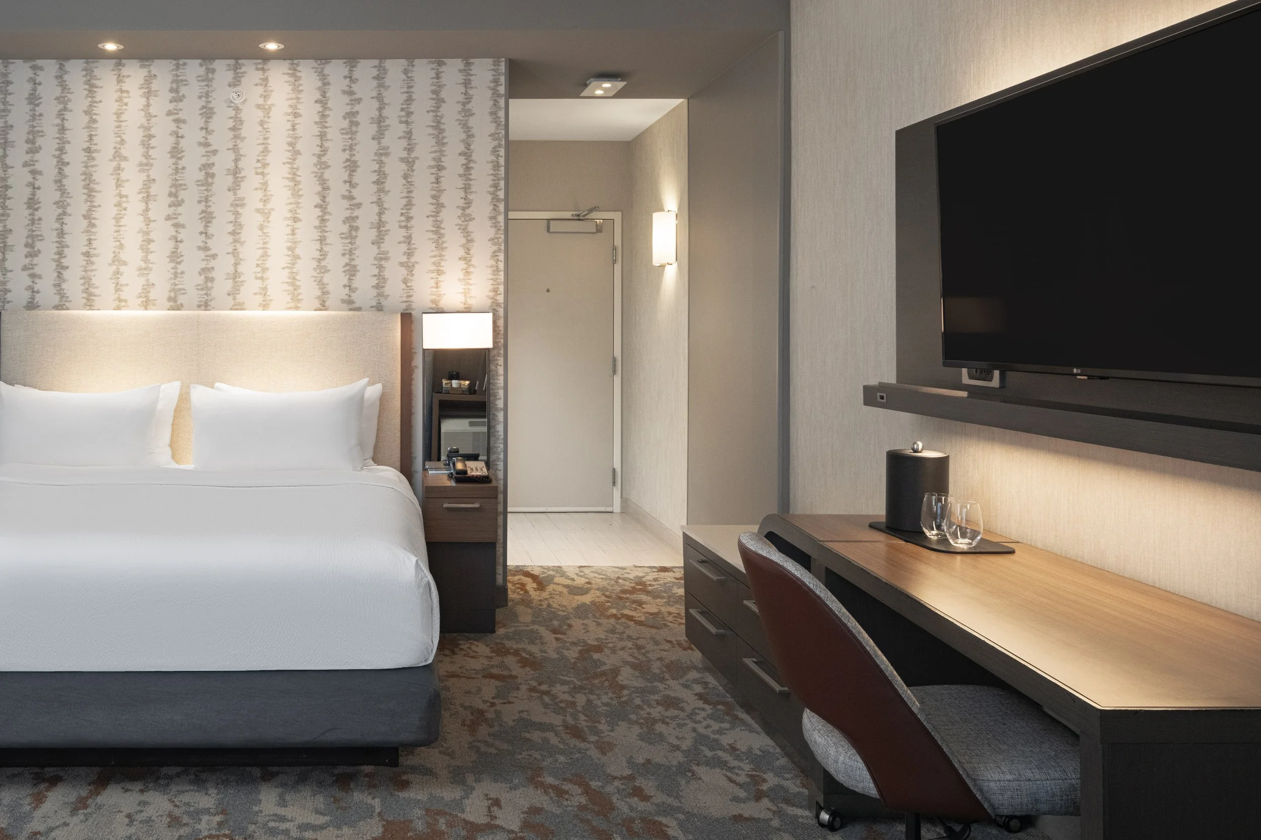  ORIGINAL FILENAME:  4922_TYSCP_Courtyard_king_door.jpg  FILE NAME:  Guest Room  PHOTO PLACEMENT TAG:  Search in DAC for: Guest Rooms  CAPTION:  King Guest Room – Entry  MARKETING CAPTION:  The King Guest Room entry angle shows the bed, work desk, te