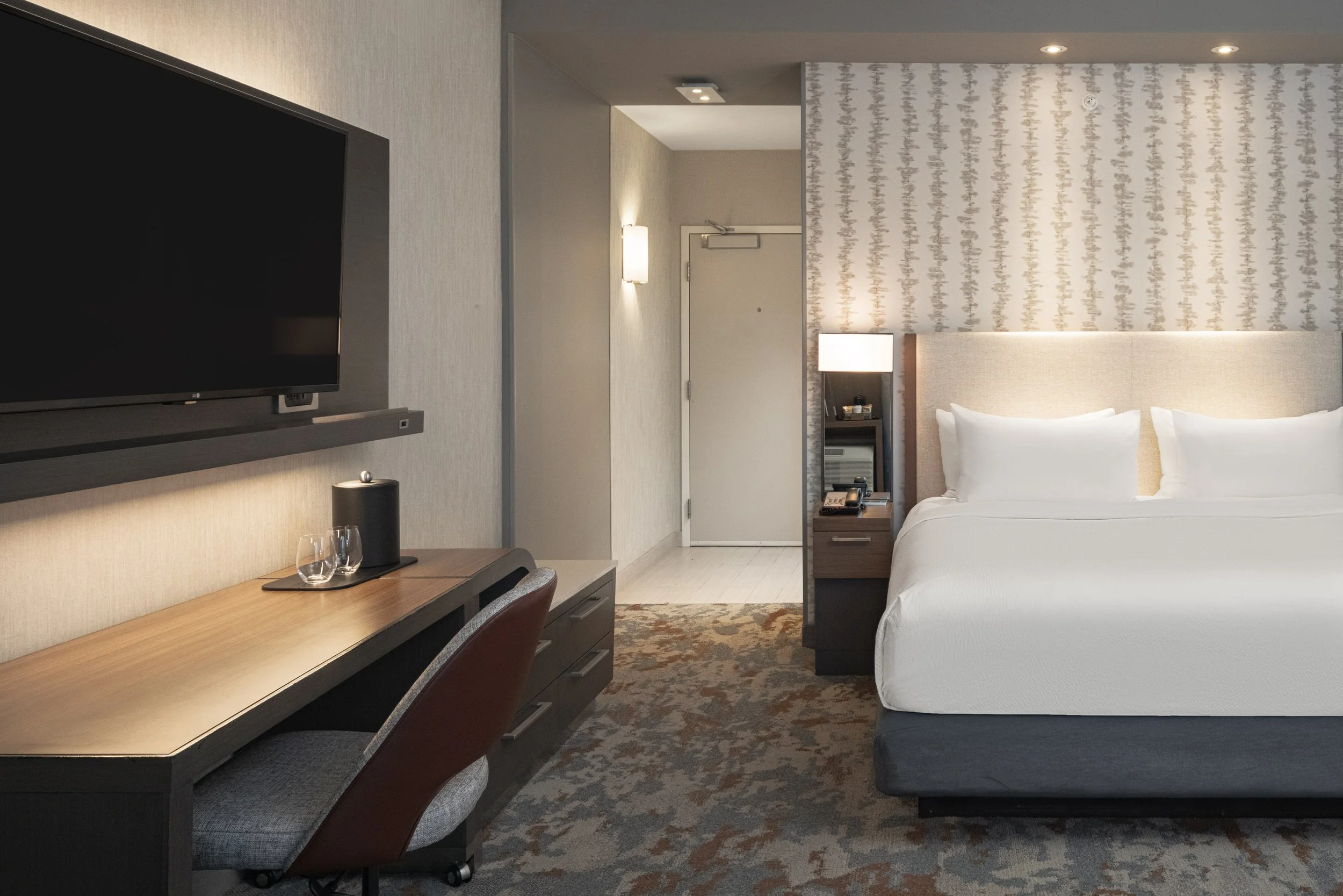  ORIGINAL FILENAME:  4926_TYSCP_Courtyard_ekng_door.jpg  FILE NAME:  Guest Room  PHOTO PLACEMENT TAG:  Search in DAC for: Guest Rooms  CAPTION:  King Guest Room – Entry  MARKETING CAPTION:  The King Guest Room entry view shows the bed, desk, TV wall,